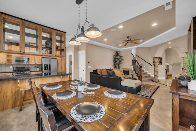 806 N 2500 W, Hurricane, UT 84737 - dining room featuring arched walkways, stairway, a tray ceiling, light tile patterned flooring, and recessed lighting