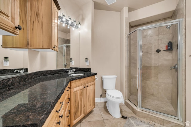 806 N 2500 W, Hurricane, UT 84737 - bathroom featuring baseboards, toilet, tile patterned floors, vanity, and a shower stall