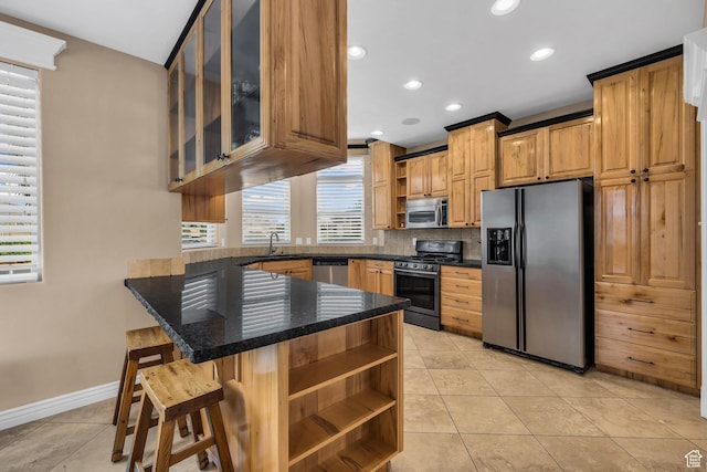 806 N 2500 W, Hurricane, UT 84737 - kitchen featuring light tile patterned flooring, a peninsula, appliances with stainless steel finishes, open shelves, and glass insert cabinets
