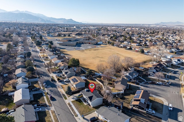 birds eye view of property with a residential view and a mountain view