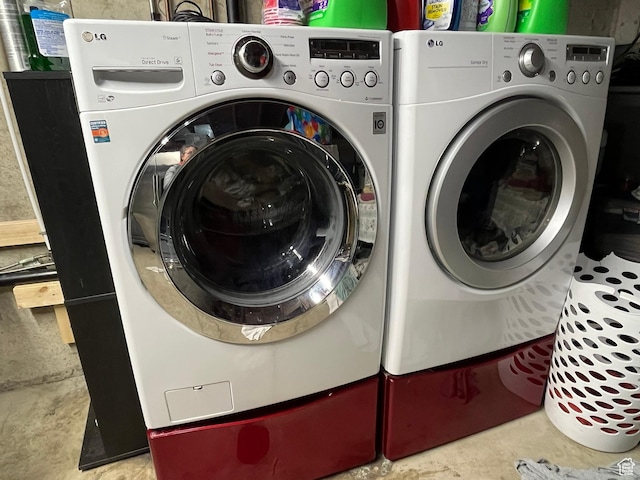 laundry area with independent washer and dryer