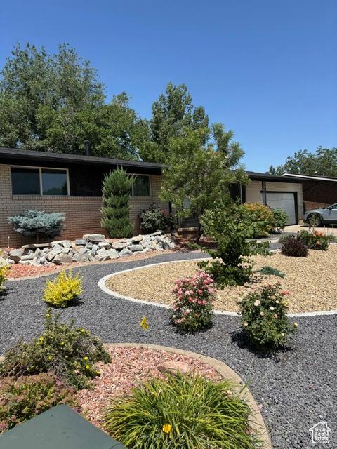 4527 S 2300 W, Roy, UT 84067 - view of front of property with brick siding and an attached garage