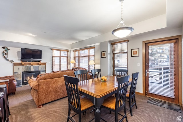 3720 N Sundial Ct Unit C007, Park City, UT 84098 - dining room featuring a fireplace, carpet flooring, and baseboards
