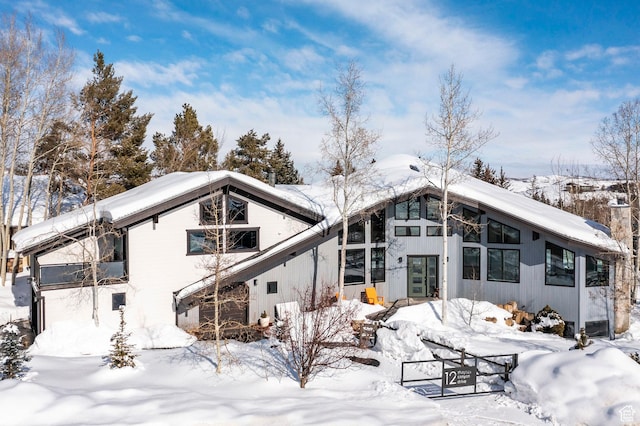 12 Thaynes Canyon Dr, Park City, UT 84060 - snow covered rear of property with a garage