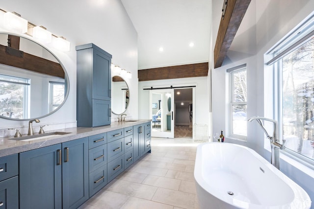 12 Thaynes Canyon Dr, Park City, UT 84060 - bathroom featuring vaulted ceiling, a soaking tub, a sink, and double vanity