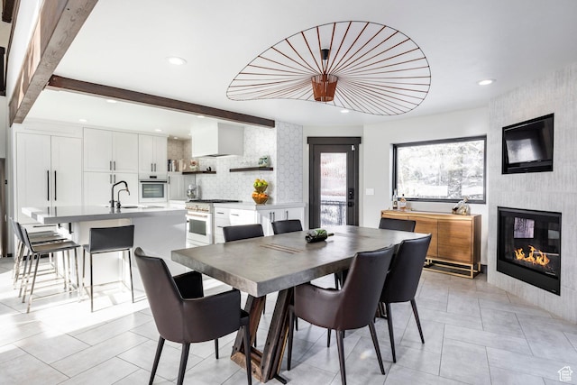 12 Thaynes Canyon Dr, Park City, UT 84060 - dining room featuring recessed lighting, a fireplace, beamed ceiling, and light tile patterned floors