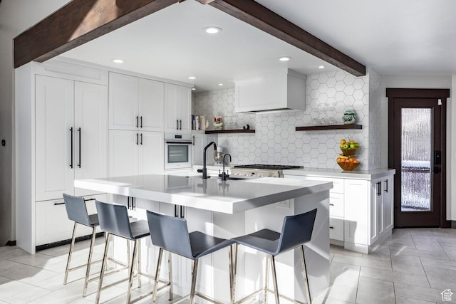 12 Thaynes Canyon Dr, Park City, UT 84060 - kitchen featuring premium range hood, white cabinets, white oven, open shelves, and beamed ceiling