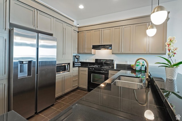 350 S 200 E Unit 404, Salt Lake City, UT 84111 - kitchen featuring under cabinet range hood, dark tile patterned floors, a sink, appliances with stainless steel finishes, and pendant lighting