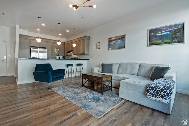 350 S 200 E Unit 404, Salt Lake City, UT 84111 - living area featuring a chandelier, wood finished floors, and recessed lighting
