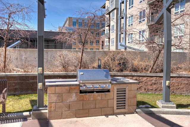 350 S 200 E Unit 404, Salt Lake City, UT 84111 - view of patio / terrace featuring fence, grilling area, and an outdoor kitchen