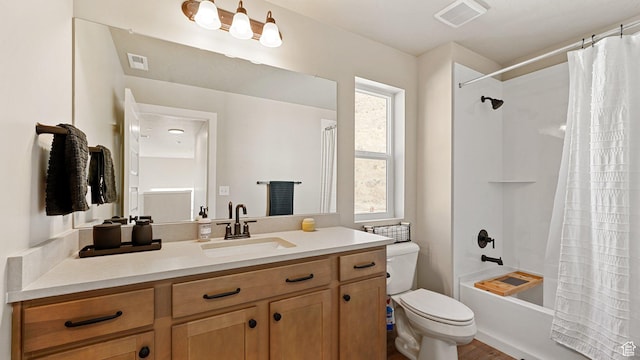 full bath with toilet, vanity, visible vents, and shower / bathtub combination with curtain