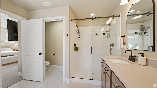 ensuite bathroom featuring a stall shower, vanity, marble finish floor, toilet, and visible vents