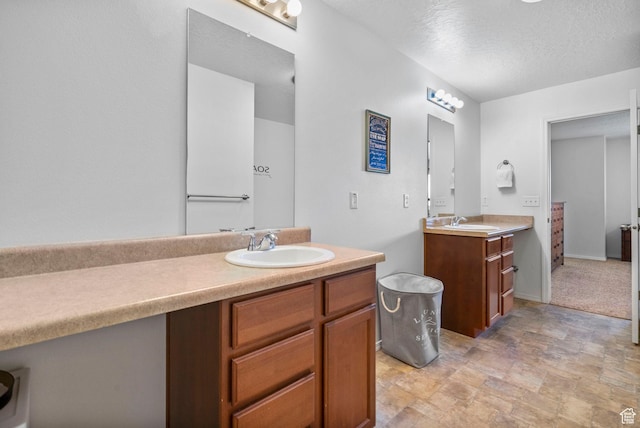 5906 Columbus Cir, Stansbury Park, UT 84074 - full bath with two vanities and a textured ceiling