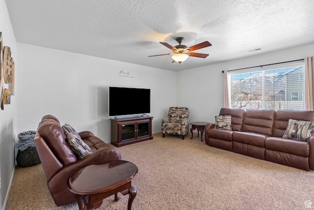 5906 Columbus Cir, Stansbury Park, UT 84074 - living room featuring carpet, a textured ceiling, and a ceiling fan