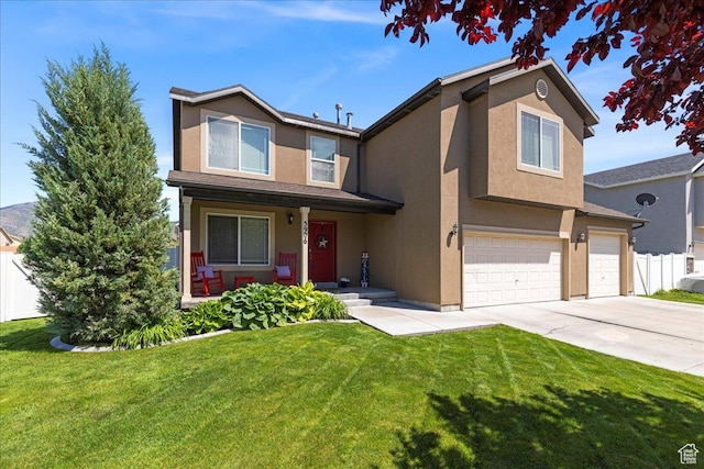 5906 Columbus Cir, Stansbury Park, UT 84074 - traditional home featuring a garage, stucco siding, and concrete driveway