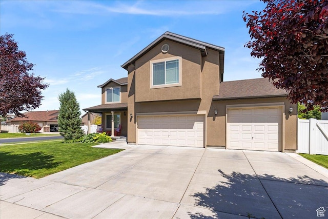 5906 Columbus Cir, Stansbury Park, UT 84074 - traditional-style house featuring concrete driveway, stucco siding, and an attached garage