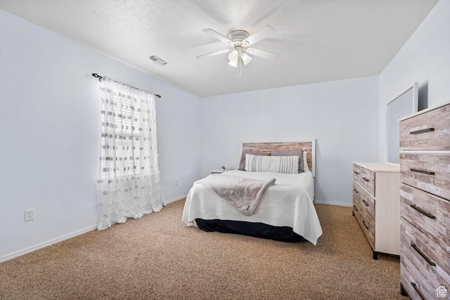 5906 Columbus Cir, Stansbury Park, UT 84074 - carpeted bedroom featuring baseboards, a ceiling fan, and a textured ceiling