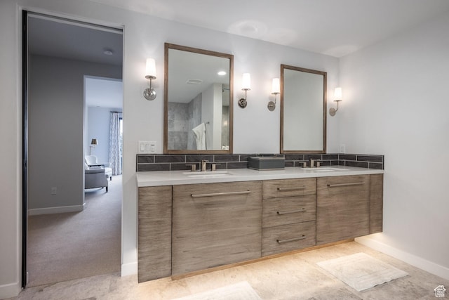6379 W Golden Bear Loop, Park City, UT 84098 - bathroom featuring decorative backsplash, double vanity, a sink, and baseboards