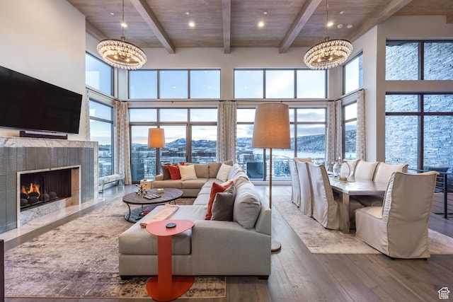 6379 W Golden Bear Loop, Park City, UT 84098 - living room featuring hardwood / wood-style floors, a high ceiling, an inviting chandelier, and a healthy amount of sunlight