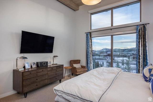 6379 W Golden Bear Loop, Park City, UT 84098 - carpeted bedroom with beam ceiling, baseboards, and a high ceiling