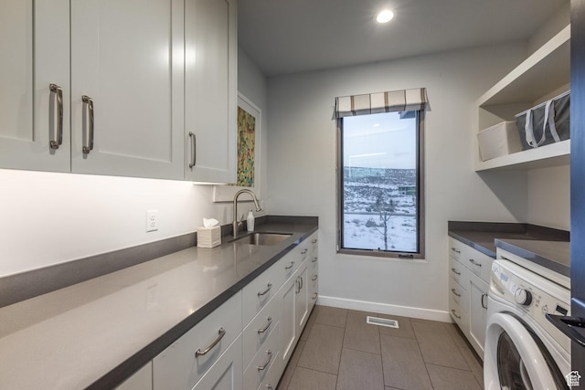 6379 W Golden Bear Loop, Park City, UT 84098 - laundry room featuring washer / clothes dryer, visible vents, a sink, baseboards, and cabinet space
