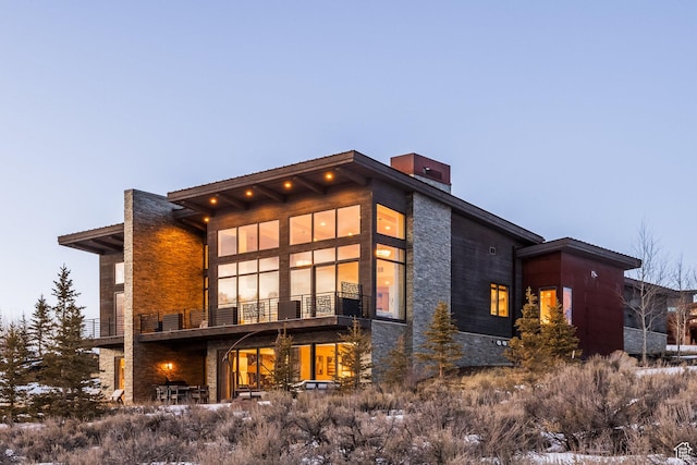 6379 W Golden Bear Loop, Park City, UT 84098 - rear view of house with stone siding and a chimney