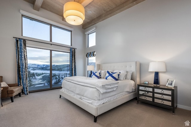 6379 W Golden Bear Loop, Park City, UT 84098 - carpeted bedroom featuring a towering ceiling, access to outside, baseboards, beam ceiling, and wood ceiling