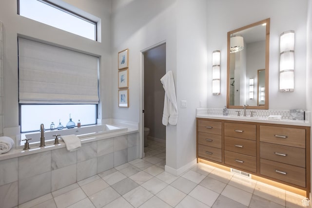 6379 W Golden Bear Loop, Park City, UT 84098 - full bathroom with visible vents, a bath, toilet, vanity, and tile patterned flooring