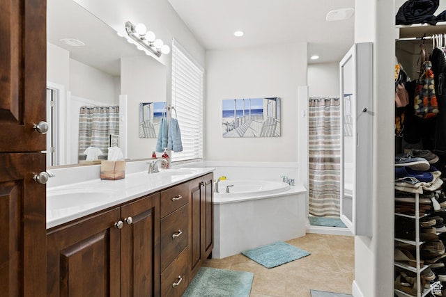 529 E Dry Ln, Washington, UT 84780 - bathroom with double vanity, a bath, a shower with shower curtain, tile patterned floors, and a spacious closet