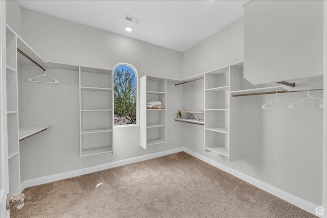 walk in closet with carpet floors and visible vents