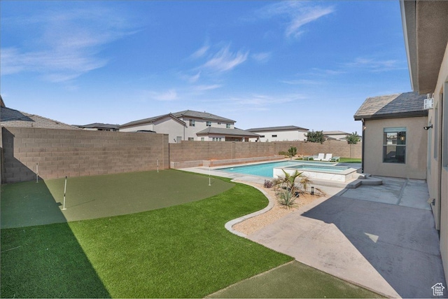 view of swimming pool with a patio area, a fenced backyard, and a pool with connected hot tub
