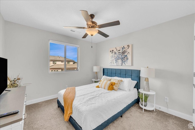 bedroom featuring ceiling fan, carpet flooring, visible vents, and baseboards