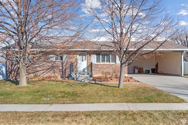 ranch-style house with driveway, a front lawn, a carport, and brick siding