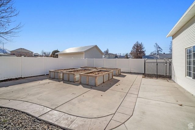742 S 600 E, Payson, UT 84651 - view of patio featuring a fenced backyard and a vegetable garden