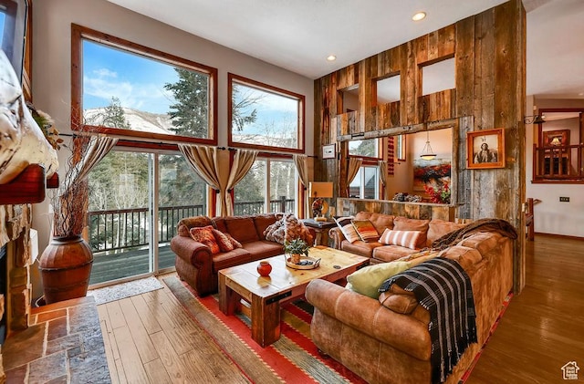 8979 N Timphaven Dr, Sundance, UT 84604 - living area featuring recessed lighting, wood walls, a high ceiling, and wood finished floors