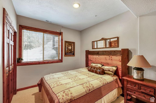 8979 N Timphaven Dr, Sundance, UT 84604 - bedroom featuring a textured ceiling, baseboards, visible vents, and light colored carpet