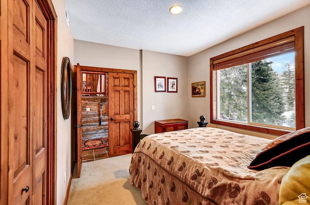 8979 N Timphaven Dr, Sundance, UT 84604 - bedroom featuring light colored carpet and a textured ceiling