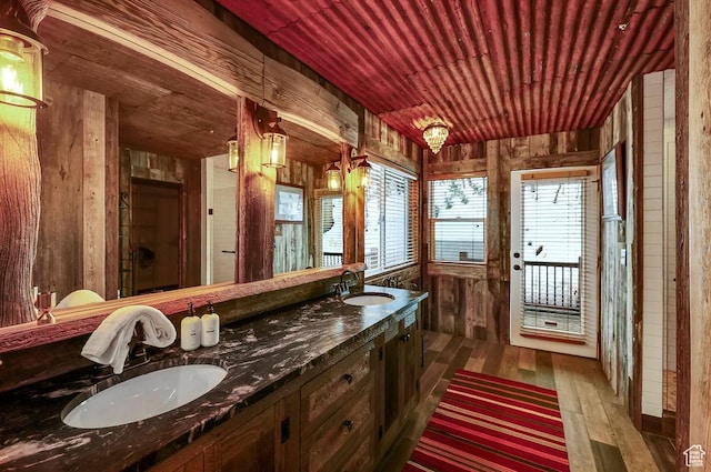 8979 N Timphaven Dr, Sundance, UT 84604 - bathroom with wooden ceiling, a sink, wooden walls, and wood finished floors