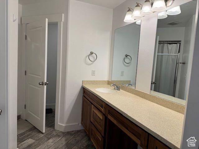 906 S 950 E, Ephraim, UT 84627 - bathroom with curtained shower, vanity, baseboards, and wood finished floors