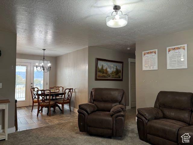 906 S 950 E, Ephraim, UT 84627 - living area with a chandelier and a textured ceiling