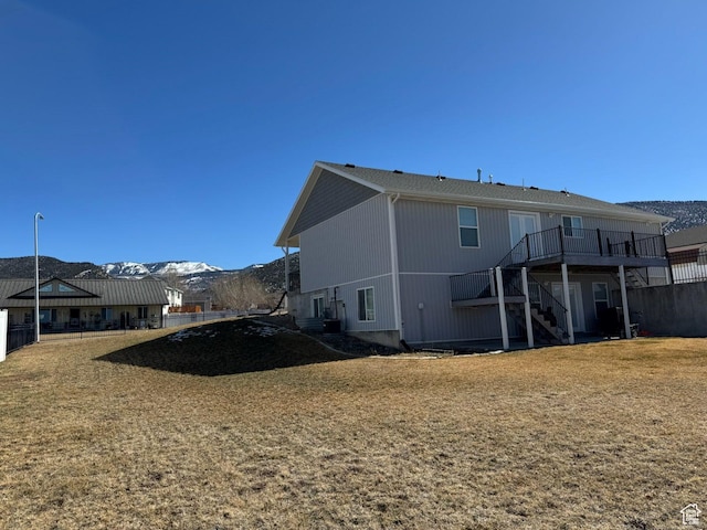 906 S 950 E, Ephraim, UT 84627 - rear view of house with a lawn, fence, a deck with mountain view, and stairs