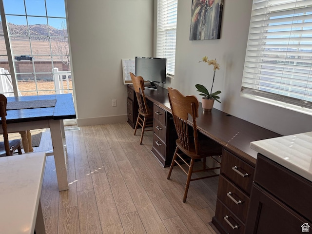 6274 N Vernon Dr E, Eagle Mountain, UT 84005 - home office with baseboards and light wood-style floors