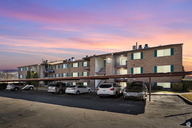 view of building exterior with covered parking