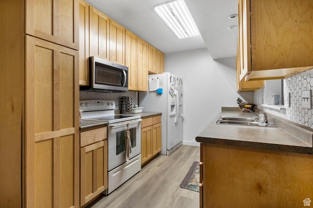 4160 S Oak Meadows Dr W Unit 11, Taylorsville, UT 84123 - kitchen with tasteful backsplash, light wood-style floors, white appliances, and a sink