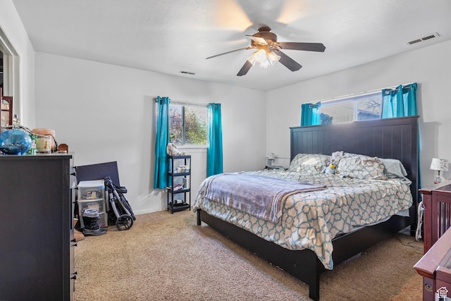 4160 S Oak Meadows Dr W Unit 11, Taylorsville, UT 84123 - bedroom with carpet, visible vents, ceiling fan, and baseboards