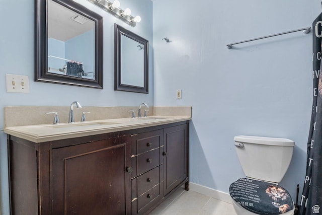 4160 S Oak Meadows Dr W Unit 11, Taylorsville, UT 84123 - full bath featuring double vanity, a sink, toilet, and tile patterned floors