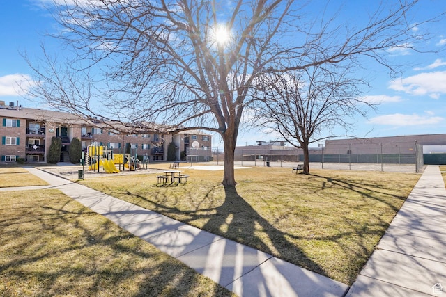 4160 S Oak Meadows Dr W Unit 11, Taylorsville, UT 84123 - view of property's community featuring a yard, a residential view, playground community, and fence