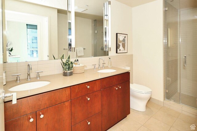 35 E 100 S Unit 1109, Salt Lake City, UT 84111 - bathroom featuring a stall shower, a sink, and toilet