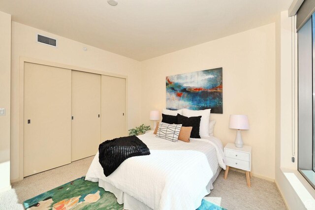 35 E 100 S Unit 1109, Salt Lake City, UT 84111 - bedroom with carpet floors, visible vents, and a closet