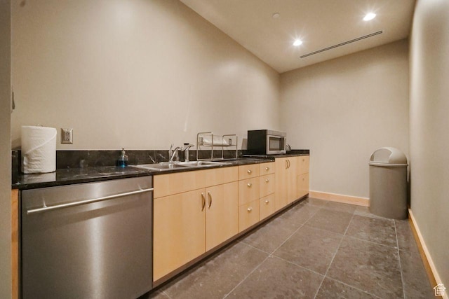 35 E 100 S Unit 1109, Salt Lake City, UT 84111 - kitchen featuring stainless steel dishwasher, light brown cabinetry, a sink, dark tile patterned floors, and baseboards